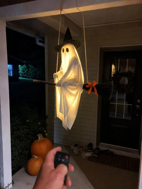 Glowing flying ghost photographed on a family front porch at night