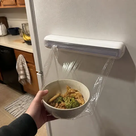 Set 2 wrap cutter mounted on a refrigerator
