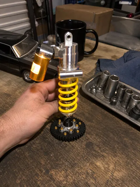 Shock absorber lamp glowing on a home garage workbench