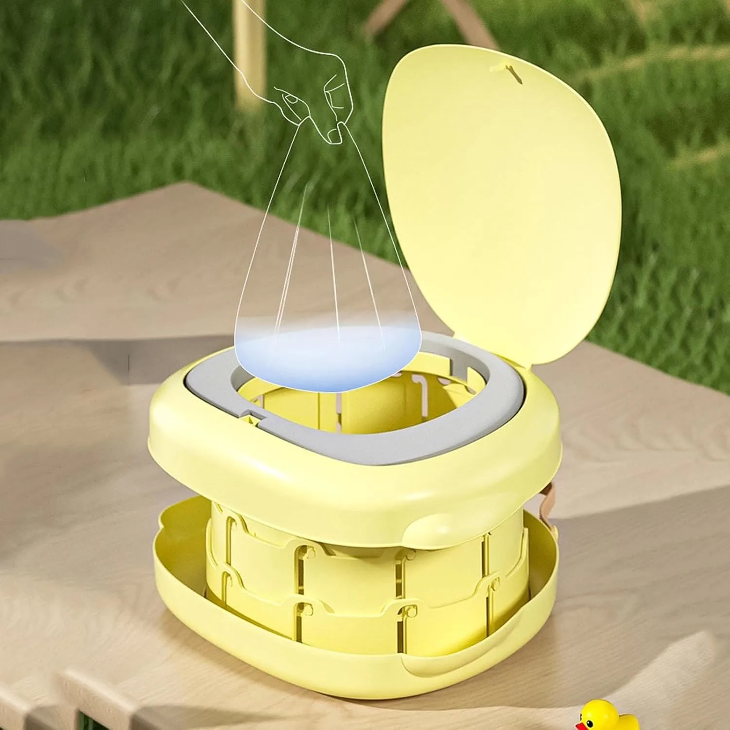 Disposable liner fitted inside the open portable potty outdoors