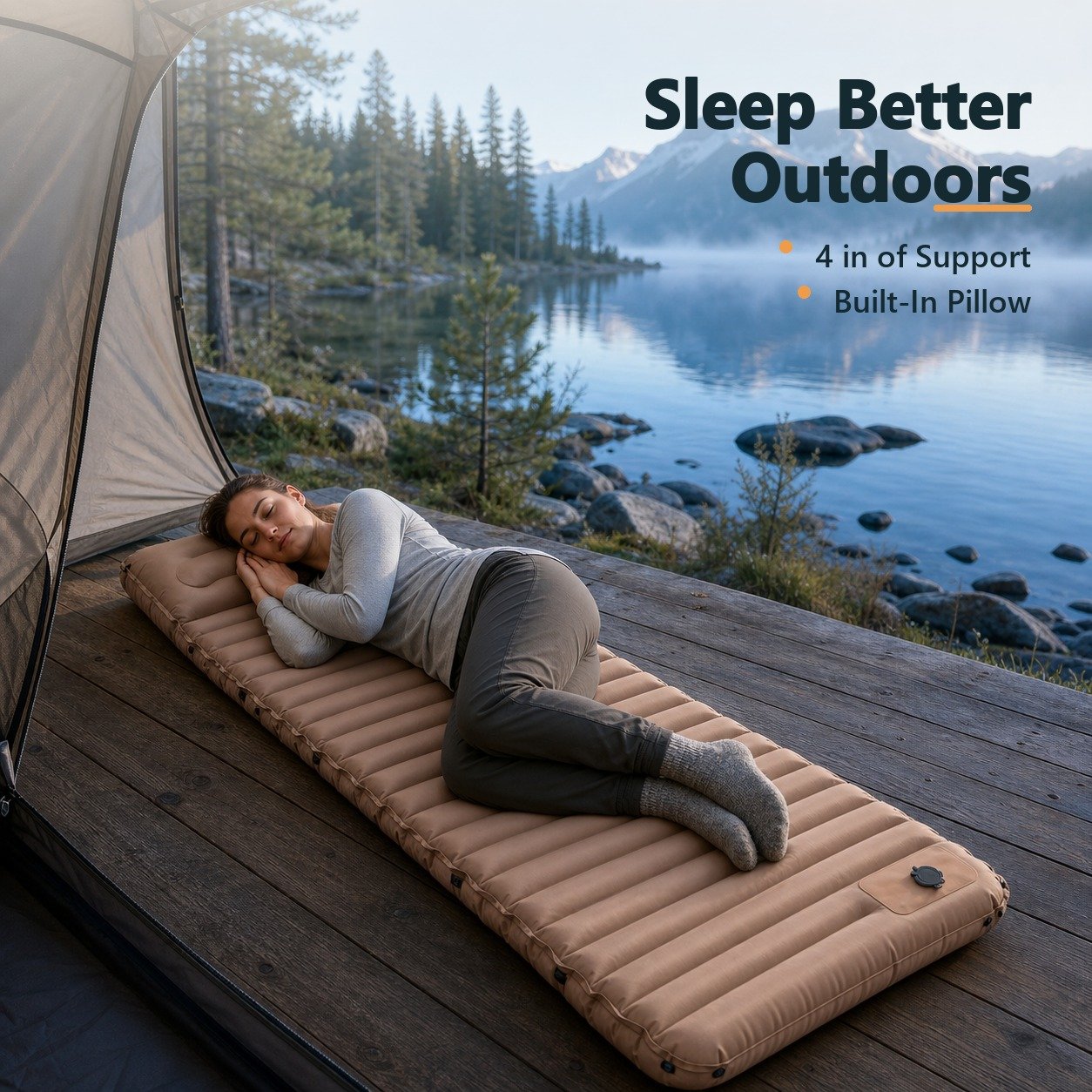 Side sleeper resting on the camping mattress at a lakeside campsite