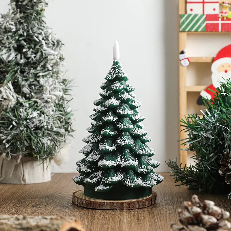 Snow-frosted Christmas tree flameless candle finish