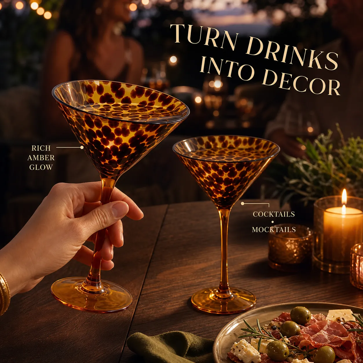 Two amber tortoiseshell martini glasses glowing at a candlelit dinner party