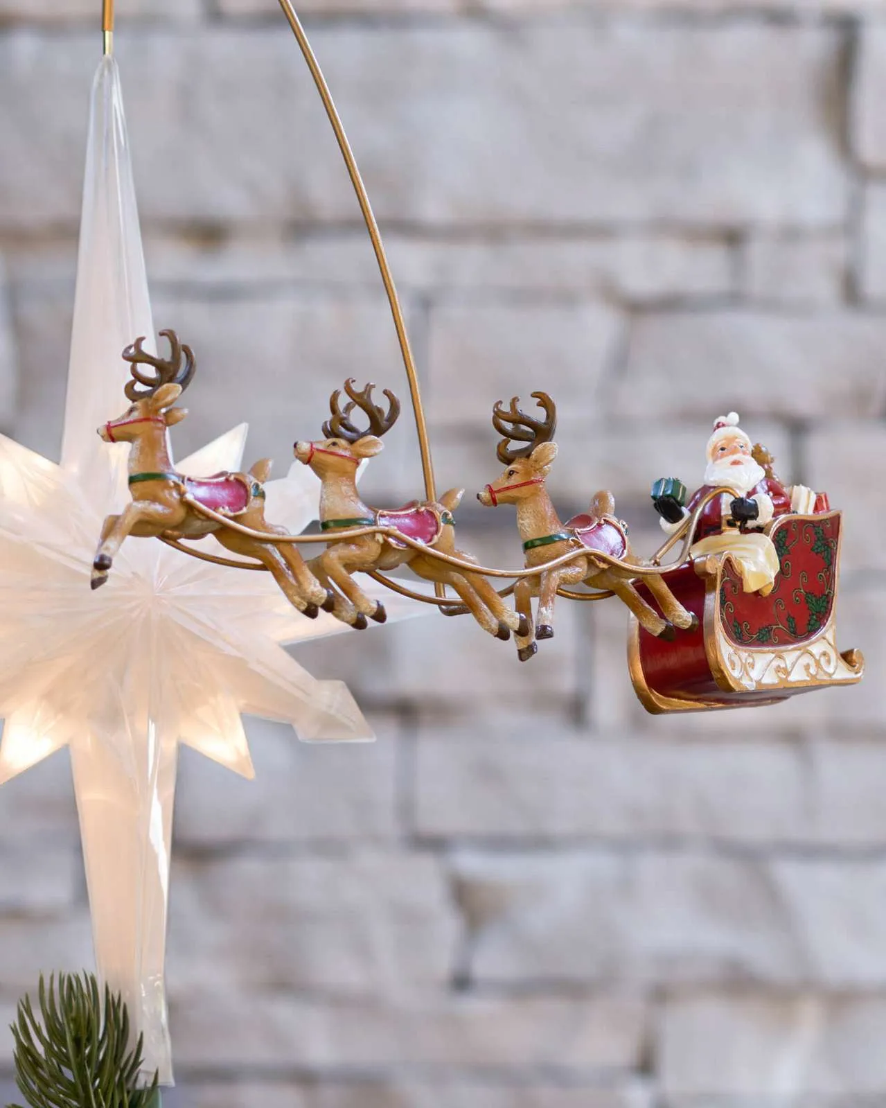 Close view of the Santa sleigh tree topper details