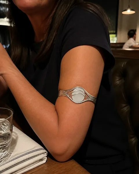 Silver bracelet worn during a casual dinner