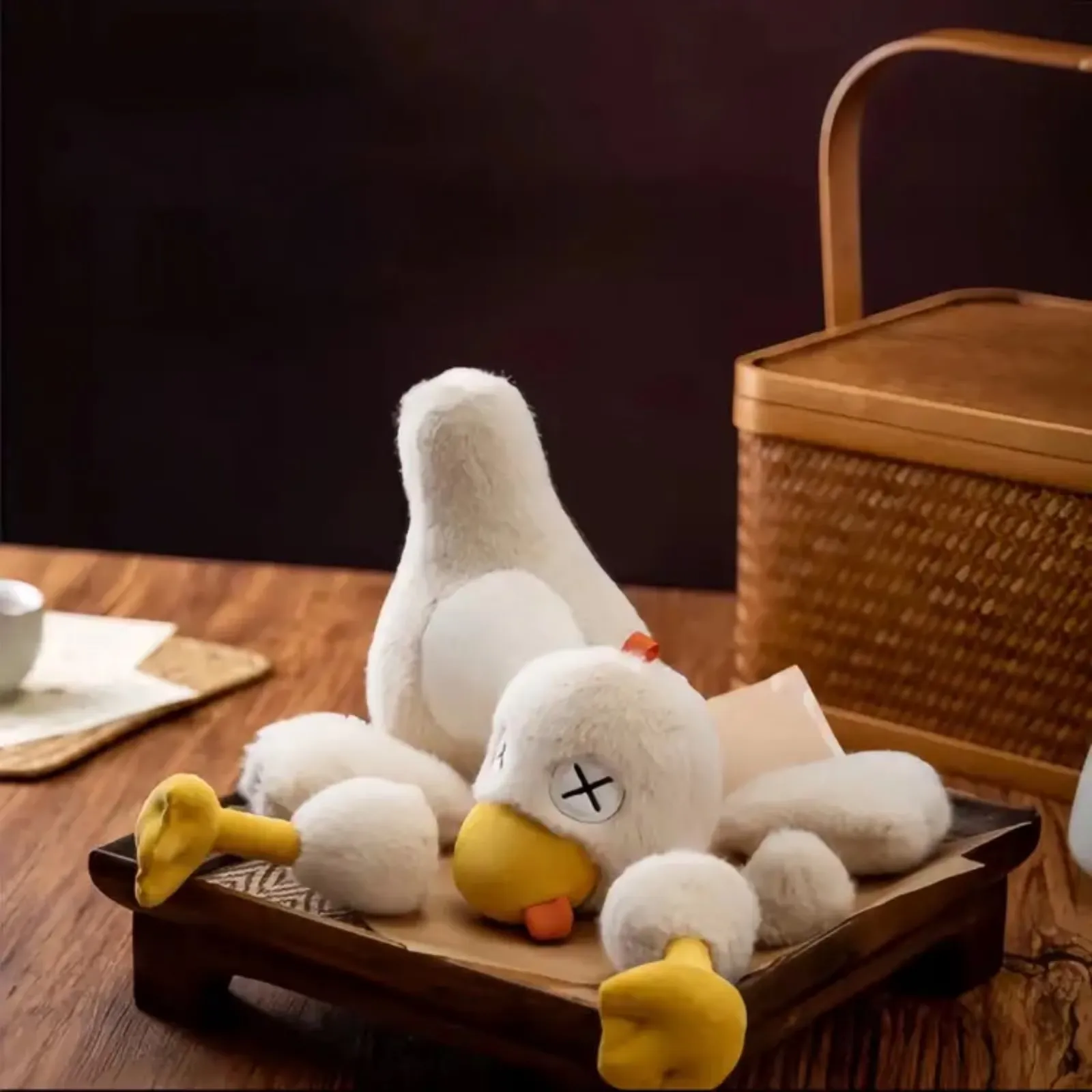 Plush character with detachable limbs arranged nearby