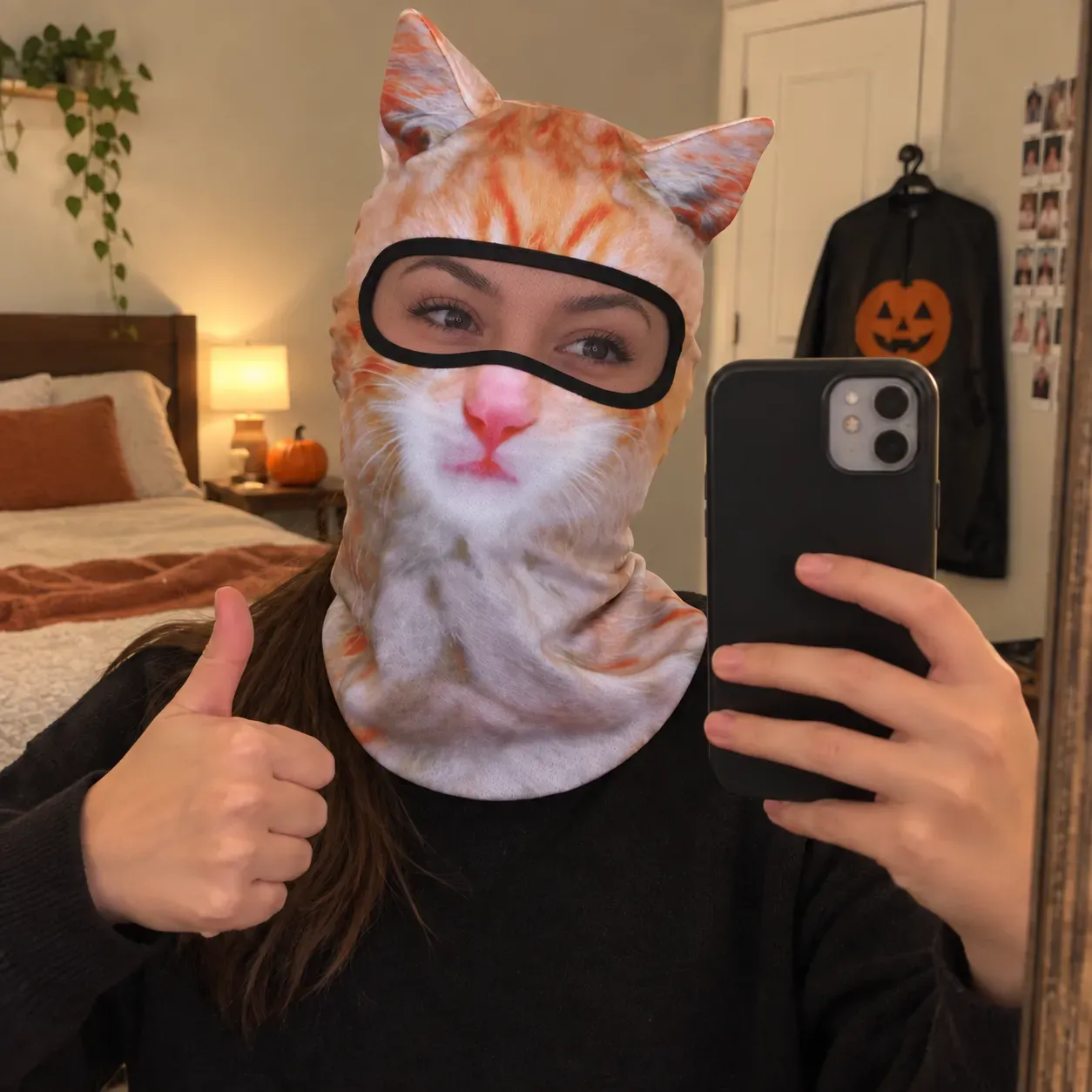 Orange tabby animal hood in a casual mirror selfie before a Halloween party