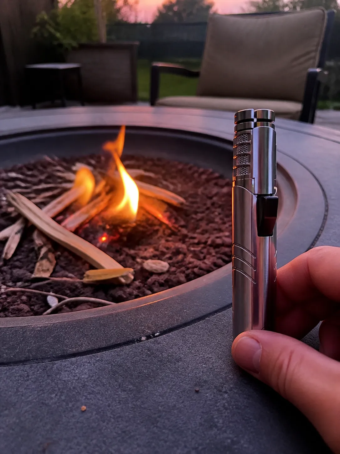 Torch beside a backyard fire pit