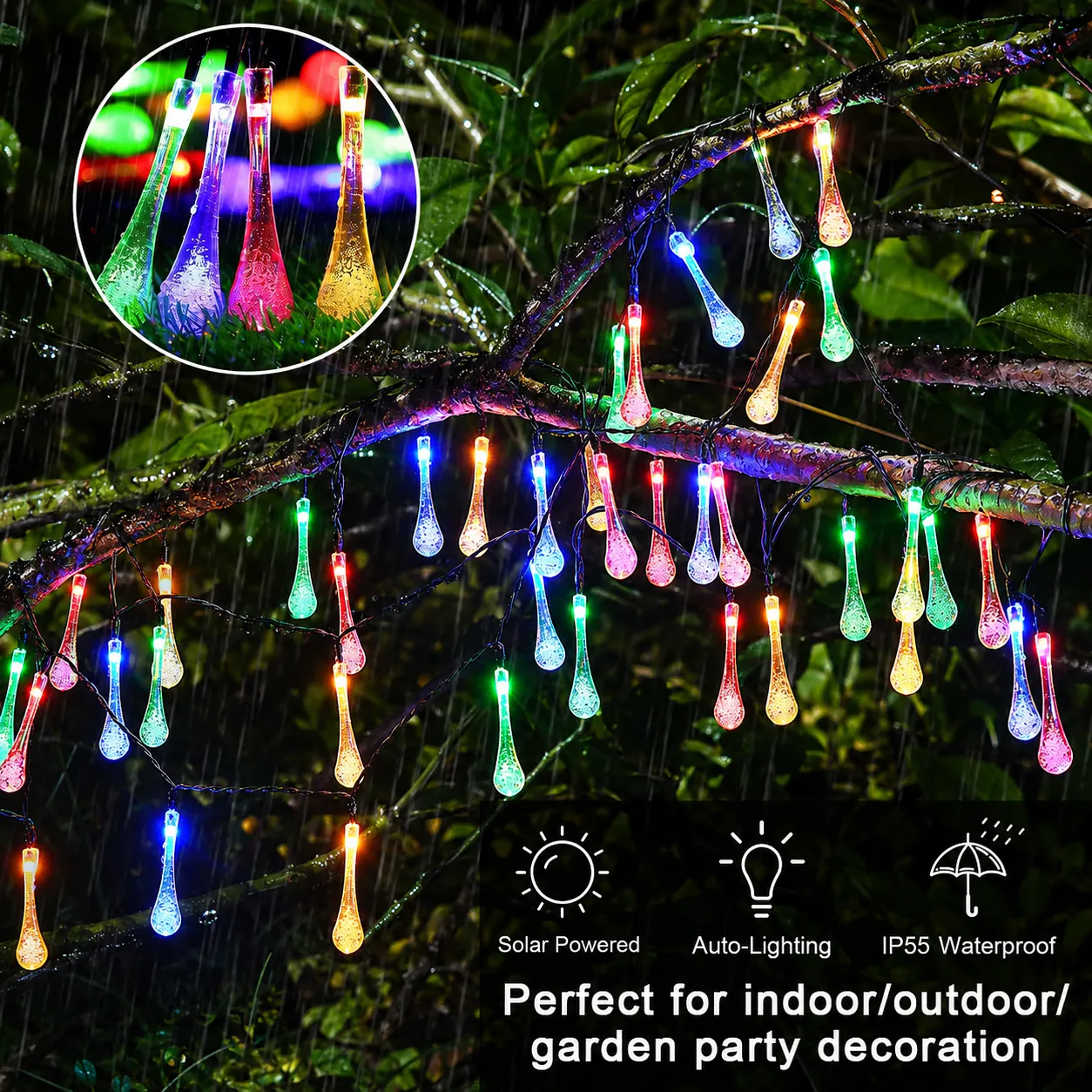 Multicolor solar teardrop lights glowing outdoors in wet weather
