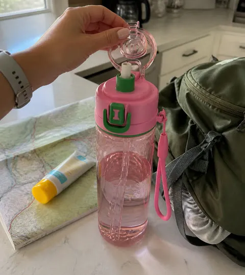 Misting bottle packed beside hiking gear