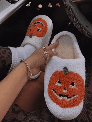 Close-up comfort demo of pumpkin house slippers