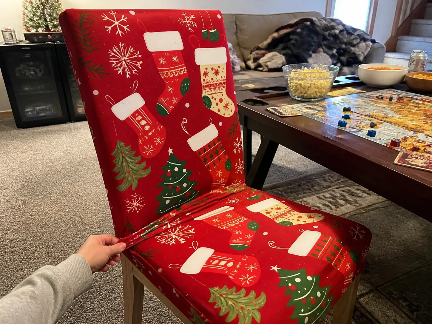 Holiday chair cover beside a game-night table
