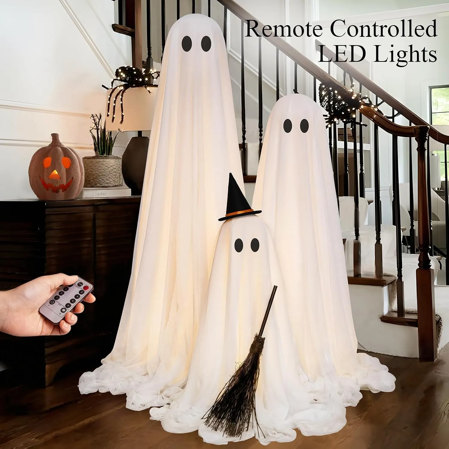 Remote-controlled warm LED lights inside the three standing ghosts