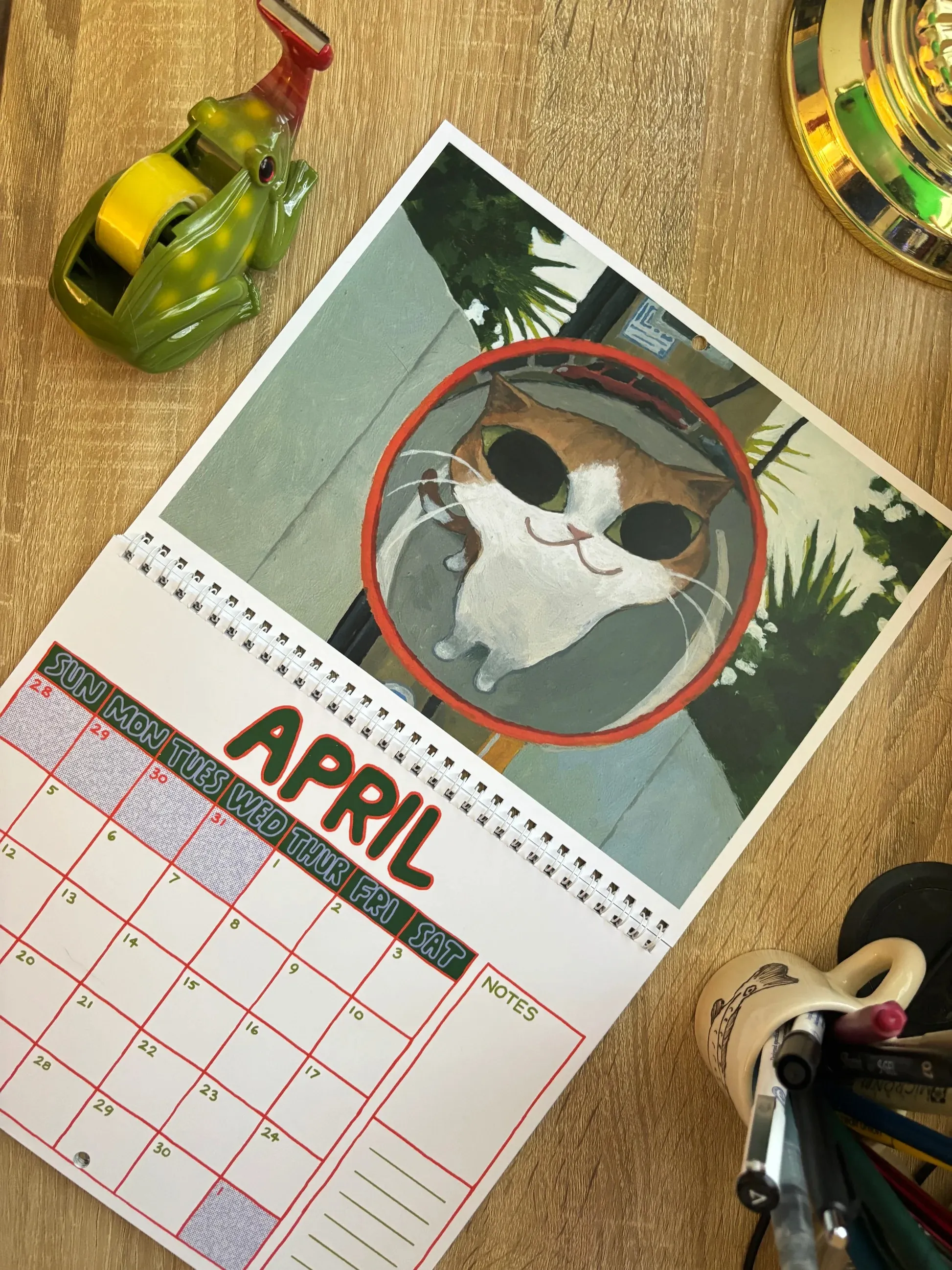 Colorful monthly cat calendar illustration