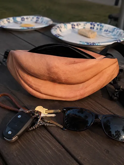 Novelty waist pack on a backyard table