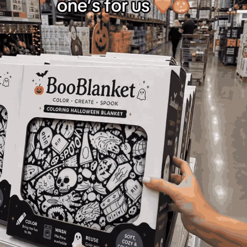 Halloween coloring blanket being unfolded and colored