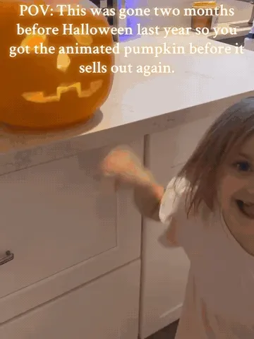Animated pumpkin changing faces and showing Halloween scenes