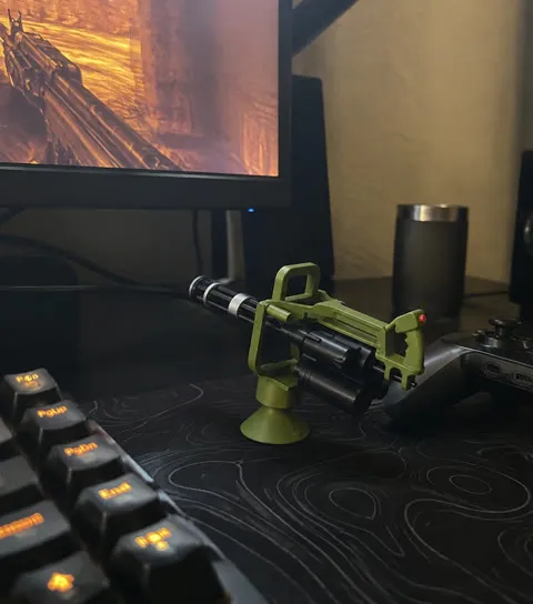 Army green ornament beside a gaming keyboard and controller