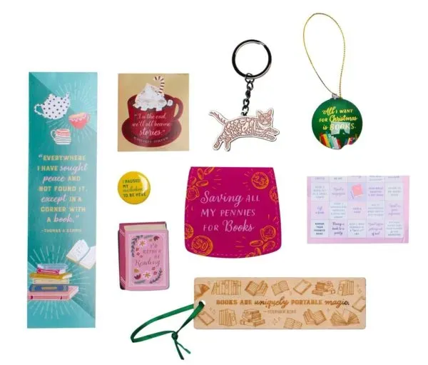 Reading-themed surprises including bookmarks, a cat keyring, an ornament and small stationery items
