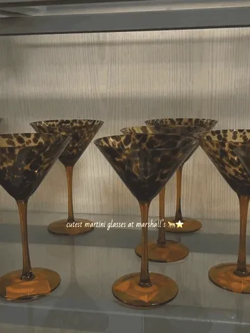 Amber tortoiseshell martini glasses glowing as the camera moves across the display