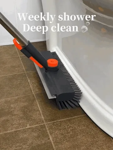 Floor brush scrubbing shower tile and cleaning around bathroom fixtures