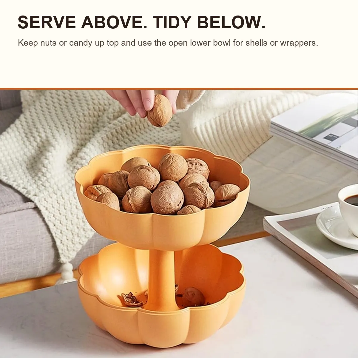 Orange two-tier pumpkin serving bowl with snacks above and shells below