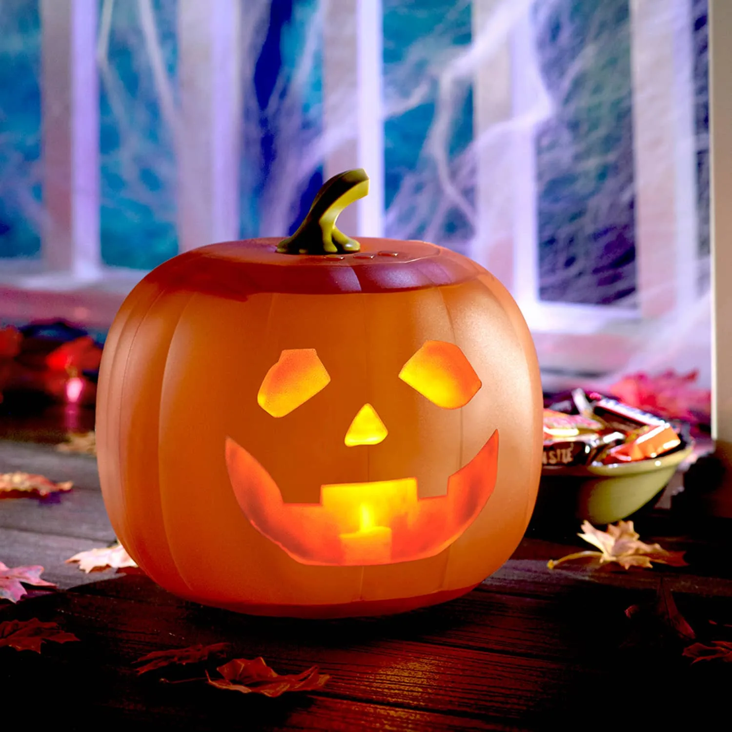 Animated pumpkin glowing on an indoor Halloween display
