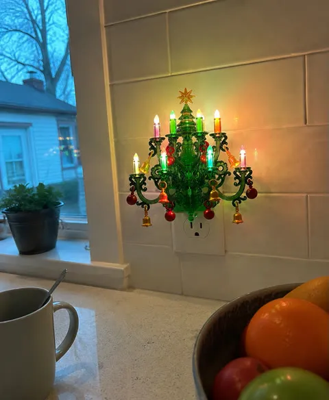 Colorful tree night light beside a kitchen counter