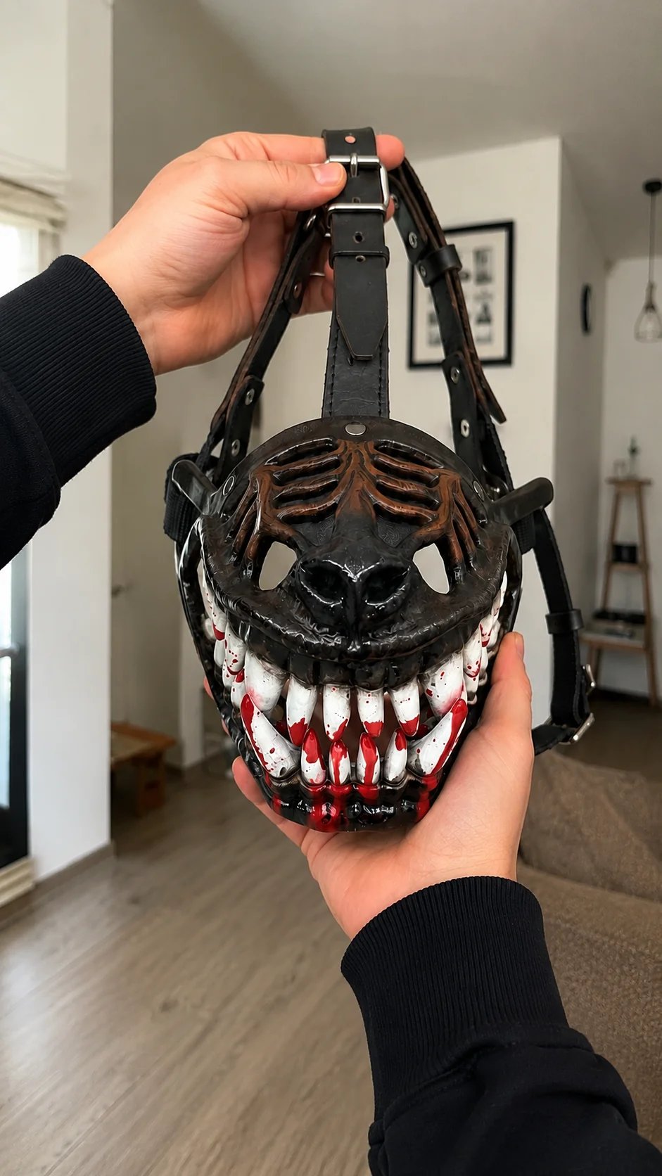 Dog wearing hell hound monster muzzle outdoors on night walk