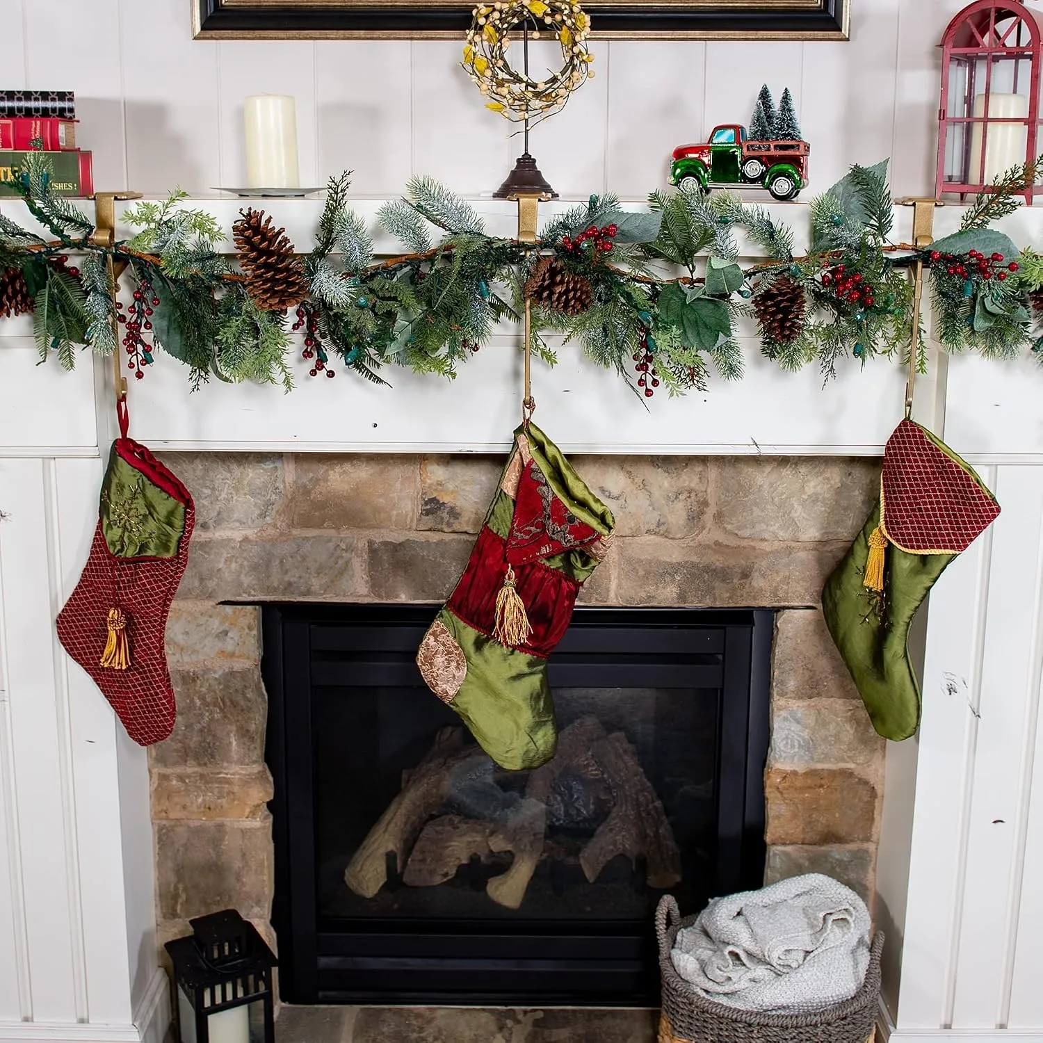 Finished Christmas mantel with garland and three stockings