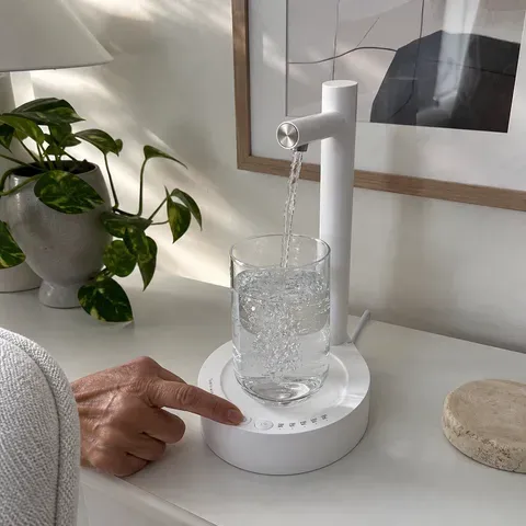 Older adult using dispenser