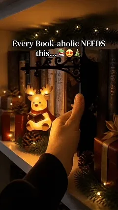 Christmas character bookshelf lamp glowing on a shelf