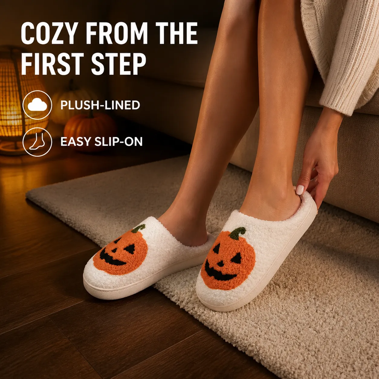 Woman slipping into white jack-o'-lantern plush house slippers