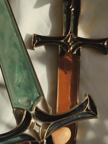 Mystic Green and Amber Gold potion daggers shown from several angles