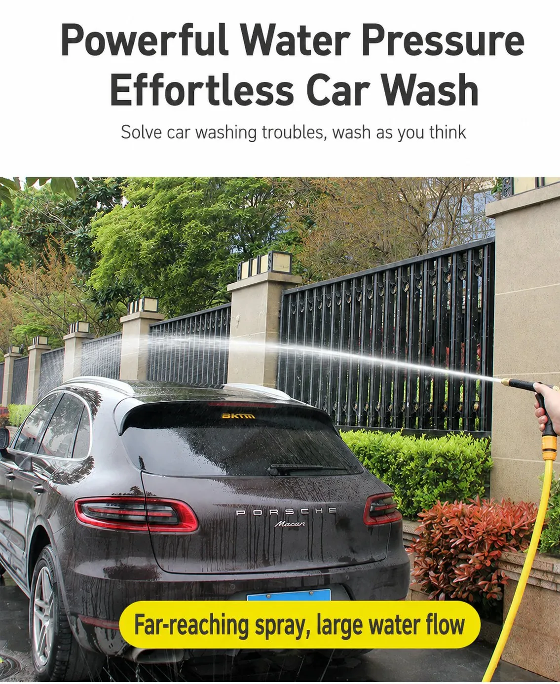 Long-reaching garden hose spray washing a vehicle