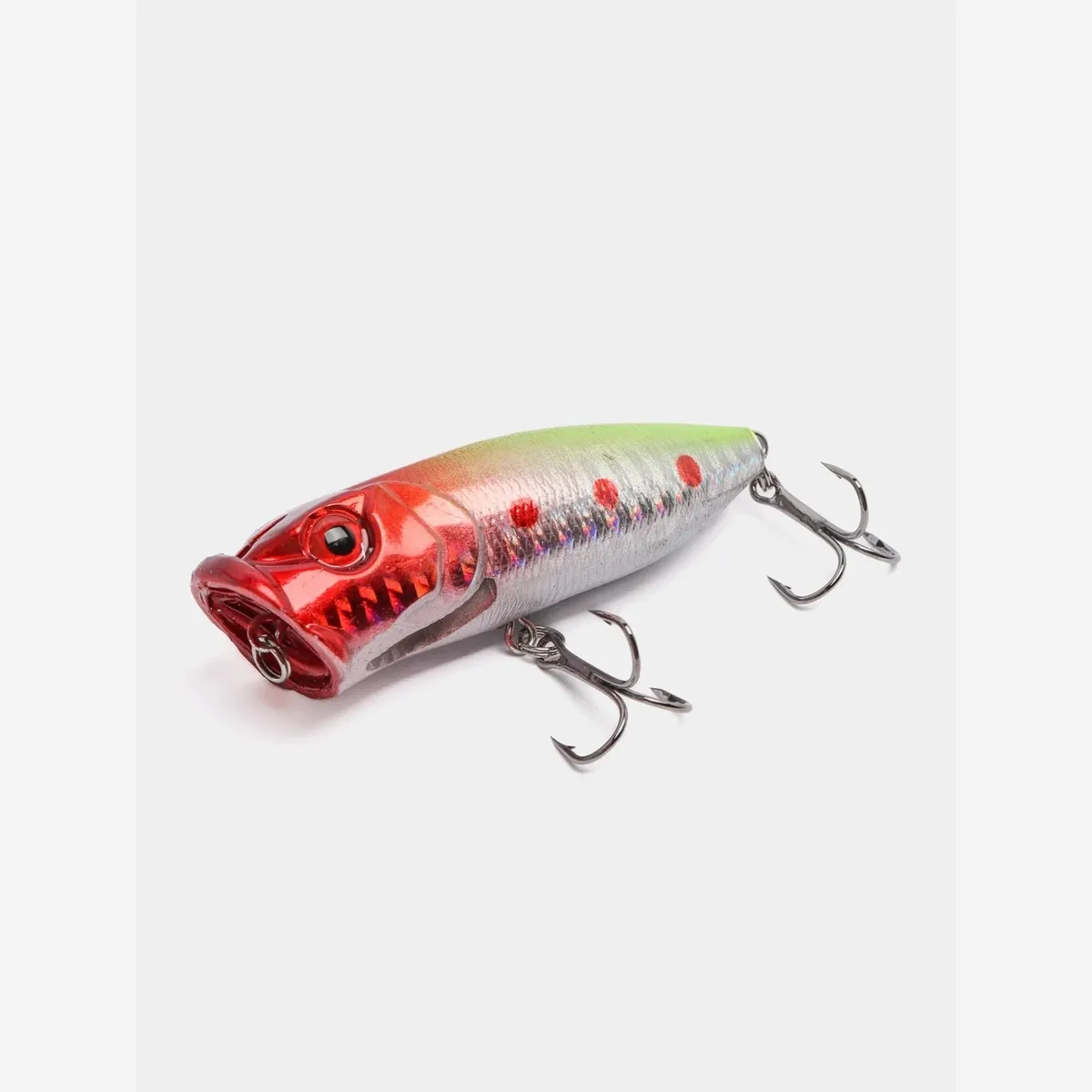 Angled close-up of the popper lure and its dual treble hooks