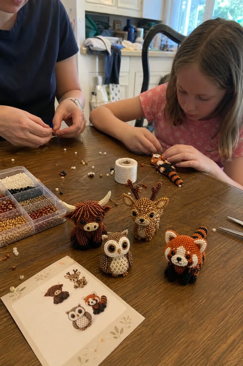 Parent and child crafting beaded animals together at a table