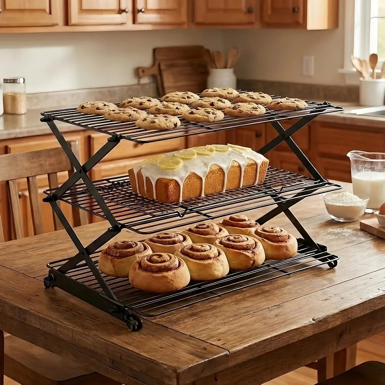 Three-tier cooling rack with bread, cookies and pastries in a home kitchen