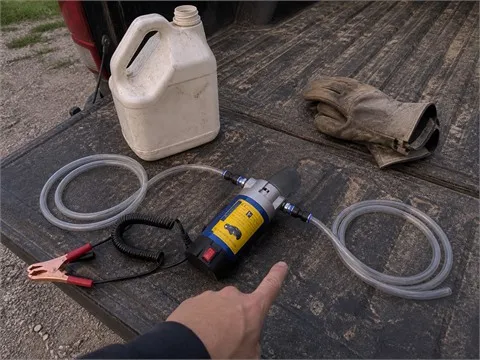 Complete oil extractor kit prepared on a pickup tailgate