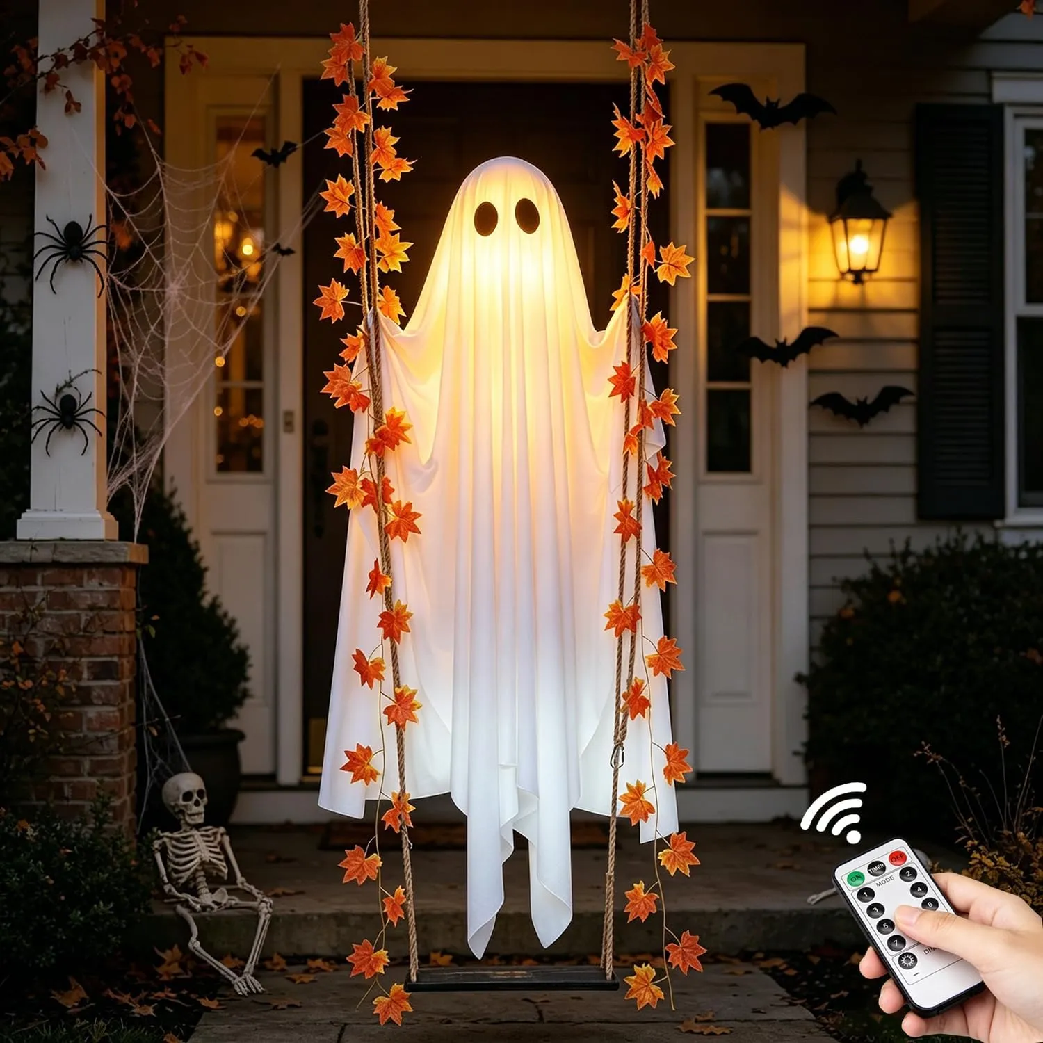 Remote-controlled glowing ghost swing on a Halloween porch