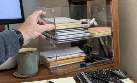 Clear organizer bins sorting home-office supplies