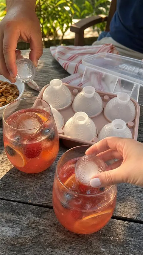 Baseball ice spheres served in backyard fruit punch