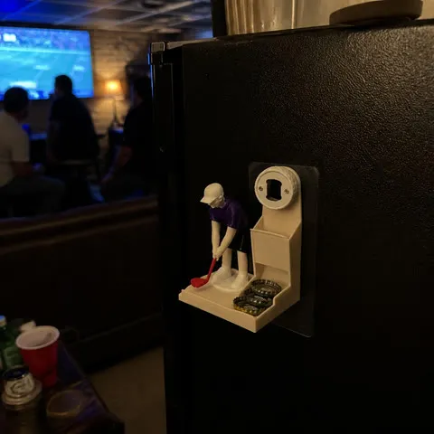 Golf bottle opener on a game-room mini fridge