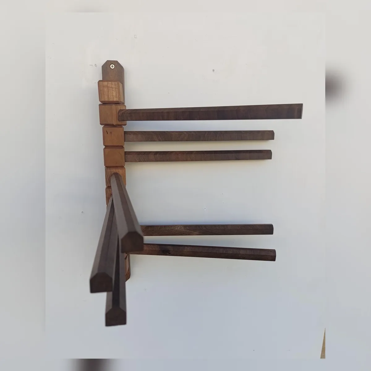Independent wooden arms shown at different angles