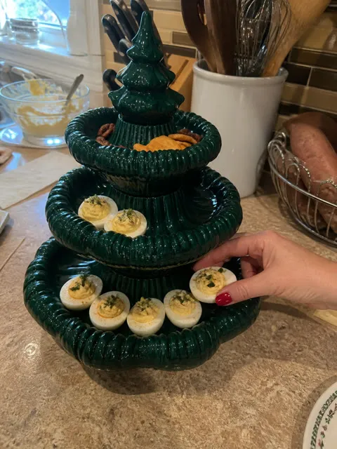 Holiday food prep with the green tiered platter on a kitchen counter