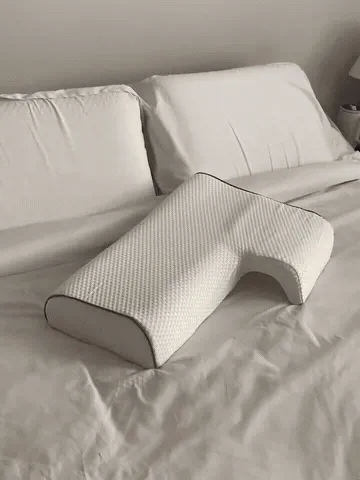Arm channel pillow in use for side sleeping and close cuddling