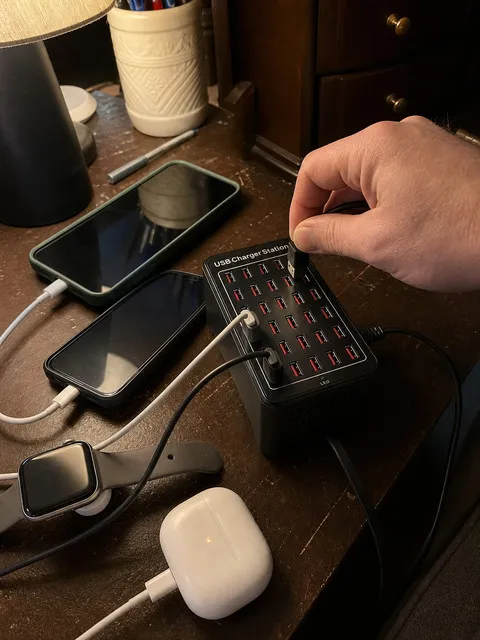 Family devices charging together on a home office desk
