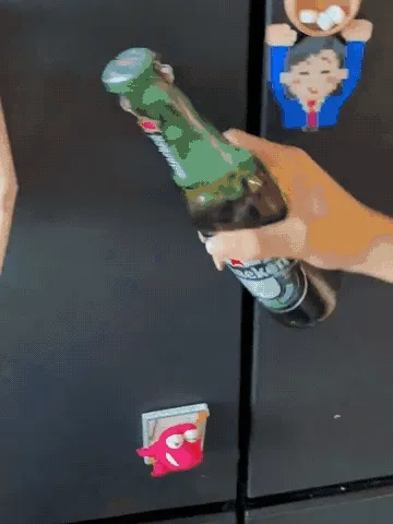 Fridge-mounted golf bottle opener in action