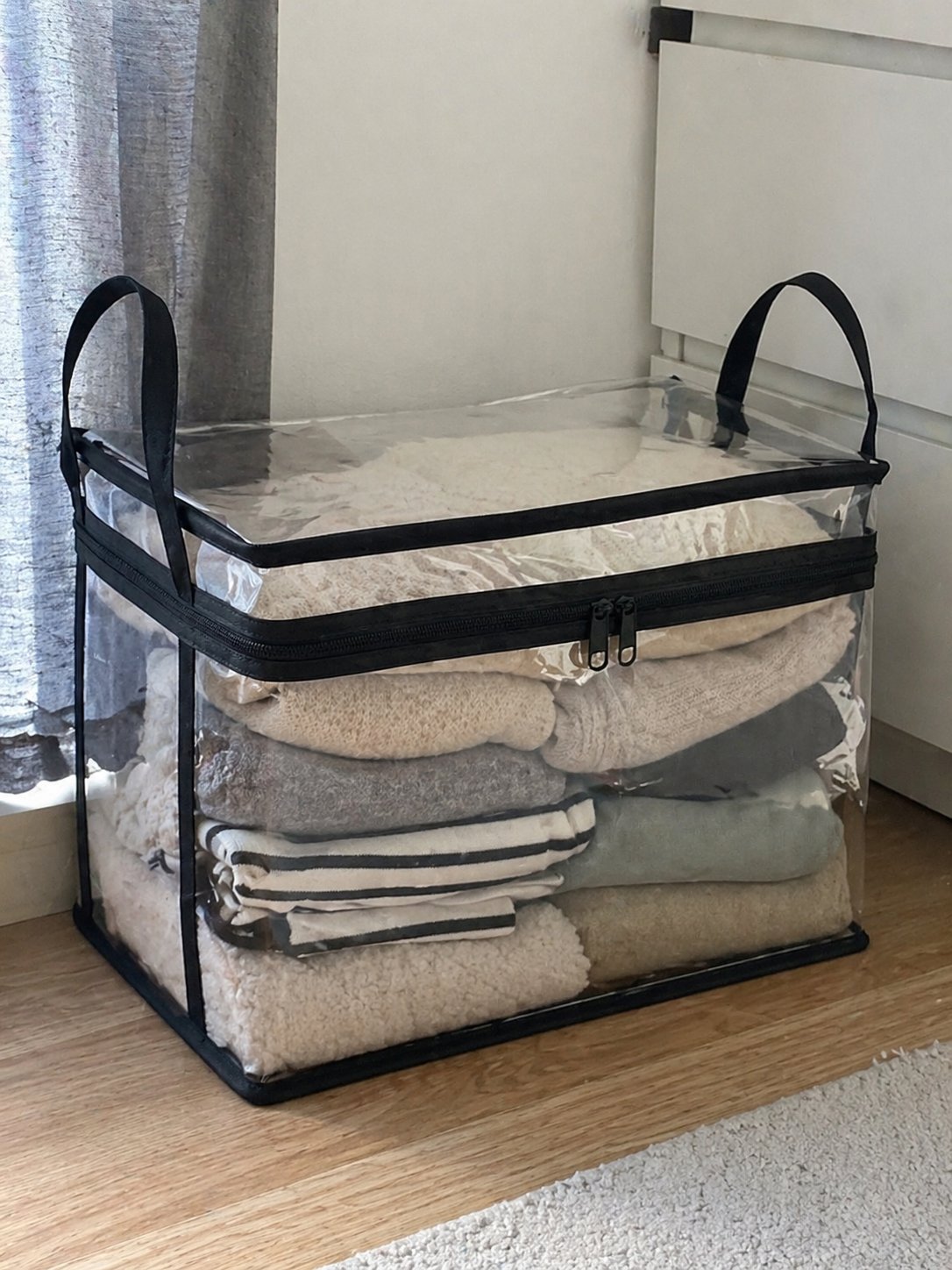 Clear bin holding books