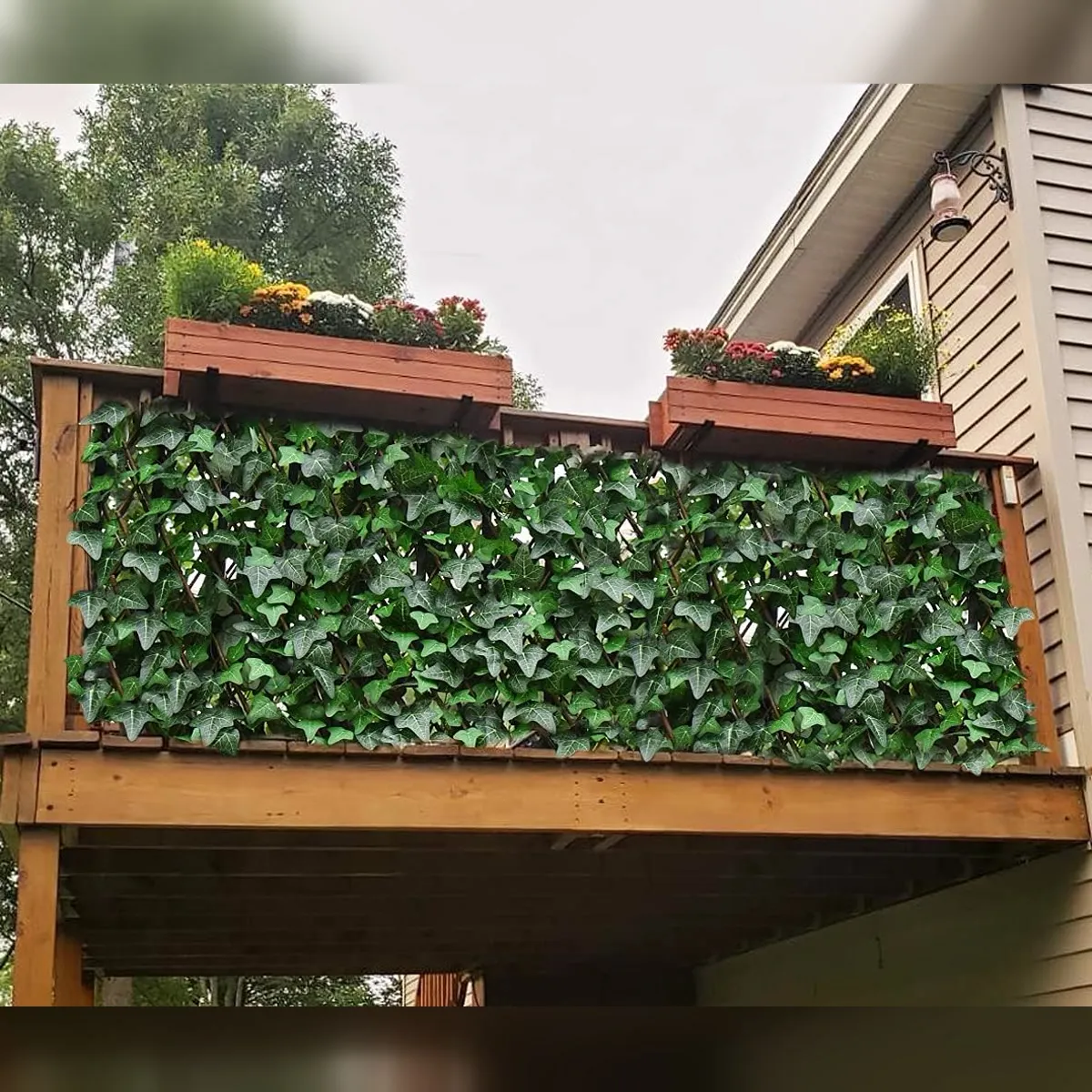 Faux ivy privacy fence installed across a balcony